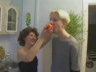 Russian mom and son playing in kitchen
